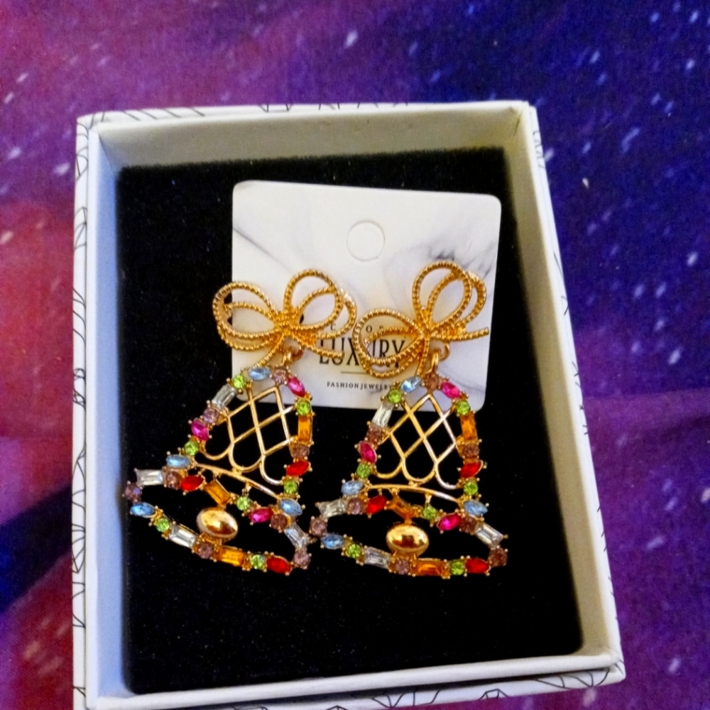 Earrings with bells with multiple different stones in them